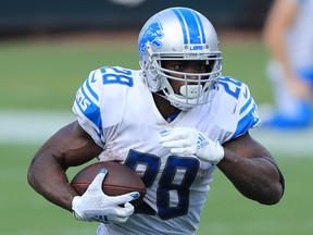 Adrian Peterson of the Detroit Lions runs the ball against the Jacksonville Jaguars at TIAA Bank Field on October 18, 2020 in Jacksonville, Florida.