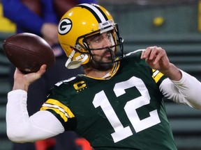 Pakcers quarterback Aaron Rodgers warms up prior to a game against the Panthers at Lambeau Field in Green Bay, Wis., Dec. 19, 2020.