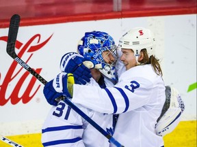Leafs goalie Frederik Andersen and defenceman Justin Holl celebrate their win over Calgary on Tuesday. USA TODAY SPORTS