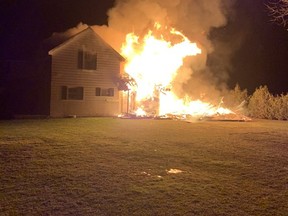 In this photo tweeted by the Leamington Fire Department, a house in the 700 block of Mersea Road 10 is ablaze on New Year's Eve.