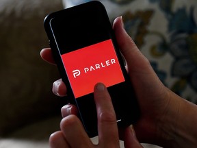 This illustration file photo taken on July 2, 2020 shows social media application logo Parler displayed on a smartphone in Arlington, Va.