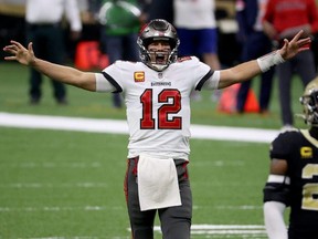 Buccaneers QB Tom Brady celebrates a first down against the Saints late in the fourth quarter in the NFC Divisional Playoff game at Mercedes Benz Superdome in New Orleans, Jan. 17, 2021.