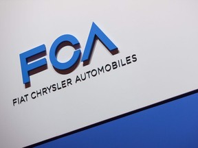 (FILES) This file photograph taken on March 6, 2019, shows a FCA (Fiat Chrysler Automobiles) logo on display during a press day ahead of the Geneva International Motor Show in Geneva.