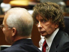 (FILES) In this file photo music producer Phil Spector(R) is seen with his attorney Roger Rosen during his murder trial at the Los Angeles Superior Court in Los Angeles on September 18, 2007.