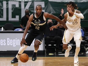 Milwaukee Bucks forward Khris Middleton drives against Dallas Mavericks forward Wes Iwundu at the Bradley Center.