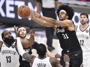 Cleveland Cavaliers center Jarrett Allen reaches for a rebound against the Brooklyn Nets in the first overtime at Rocket Mortgage FieldHouse.