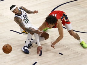 Utah Jazz guard Jordan Clarkson and New Orleans Pelicans center Jaxson Hayes battle in the fourth quarter at Vivint Smart Home Arena.