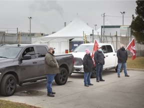 Unifor members blockade the east entrance to the Windsor Assembly Plant at Walker Road and Vimy Avenue, Tuesday, Jan. 5, 2021.