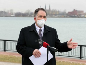 Windsor West MP Brian Masse speaks with media on the Windsor riverfront with Detroit in the background on Jan. 6, 2021.