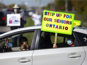 People are shown Oct. 8, 2020, participating in a day of action on long-term care outside Heron Terrace. Vaccinations of senior at local long-term care and retirement facilities has now begun.