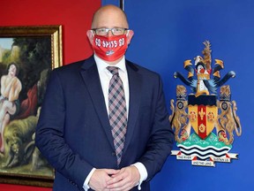 Windsor Mayor Drew Dilkens and the City of Windsor's coat of arms on Aug. 13, 2020.