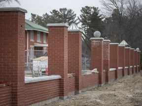 A fence with brick pillars is being built at Jack Miner Migratory Bird Sanctuary in Kingsville.