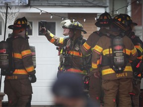 Windsor firefighters are shown at a house fire in the 1000 block of Matthew Brady Boulevard on Friday, January 15, 2021. The fire, which started in the kitchen then spread into the roof, started at approximately 4:00 p.m. No one was injured.