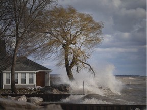 Lake levels will be lower this year but remain dangerously high. Shown here on April 13, 2020, waves crash against the Lake Erie shoreline along Point Pelee Drive during a flood warning.