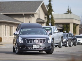 A funeral procession leaves Families First funeral home on Dougall Avenue on Jan. 14, 2020.