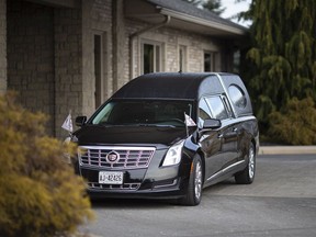 A hearse is parked outside Families First funeral home on Dougall Avenue on Jan. 14, 2020.