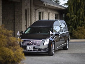 A hearse is parked outside Families First funeral home on Dougall Avenue on Jan. 14, 2020. COVID-19 has become the most common cause of death in Windsor and Essex County.