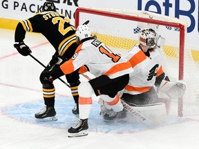 Tecumseh native Jack Studnicka (23) scores for the Boston Bruins on Philadelphia Flyers goaltender Carter Hart (79) on Thursday for his first NHL goal.