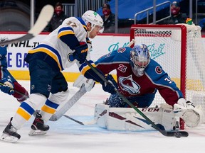 Jan 15, 2021; Denver, Colorado, USA; St. Louis Blues left wing Jaden Schwartz (17) controls the puck against Colorado Avalanche goaltender Philipp Grubauer (31) in the first period at Ball Arena. Mandatory Credit: Isaiah J. Downing-USA TODAY Sports