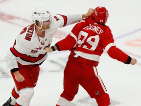 Detroit Red Wings centre Sam Gagner and Carolina Hurricanes defenseman Dougie Hamilton fight in the second period at Little Caesars Arena.