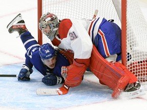 Toronto Maple Leafs center Auston Matthews runs into Montreal Canadiens goaltender Carey Price at Scotiabank Arena.