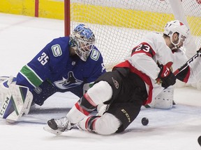 Vancouver Canucks goalie Thatcher Demko (35) makes a save on Ottawa Senators forward Cedric Paquette (23) in the third period at Rogers Arena. Vancouver won 5-1.