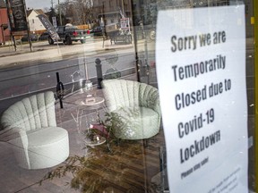 WINDSOR, ONT:. JANUARY 14, 2021 - A sign informing customers of closure due to the lockdown is seen on the front door of Timeless Treasures in Walkerville, on the first day of a stay-at-home order from the Provincial government, Thursday, Jan. 14, 2020.