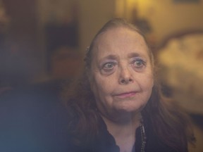 Kaye Brown, a resident at The Village at St. Clair and president of the residents' council, is pictured through the window to her room, Wednesday, January 27, 2021.