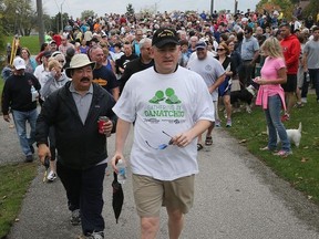 Hundreds of people joined Mayor Drew Dilkens on Oct. 15, 2017, in a mayor's walk along the Little River in the Riverside area. The event was held to show support for Sara Ann Widholm, the elderly victim of a random attack on the Ganatchio Trail a week earlier that led to her death.