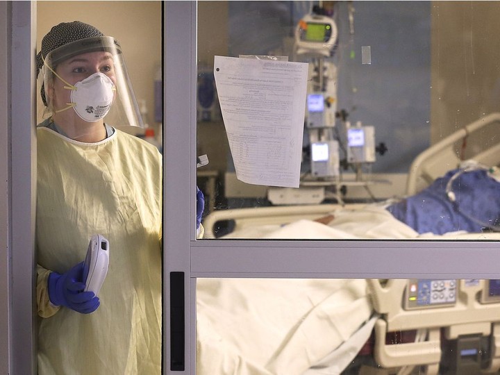  Suited up in protective gear, nursing student Bailey Zilliges is shown on Monday, caring for a COVID-19 patient at the Met campus ICU.