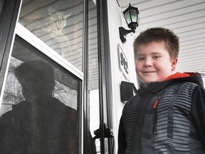 Braiden Bendzsak visits Hunter the cat near his home in Windsor, ON. on Tuesday, January 26, 2021. The nine-year-old found the feline after it was missing for 74 days.