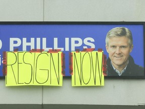 Homemade signs were taped to signage outside the plaza on Rossland Rd. West in Ajax where former Ontario Finance minister Rod Phillips has his constituency office. Phillips though is said to be staying on as the MPP for the region  on Sunday January 3, 2021.