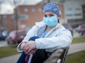Tanya Hughes, who started a Facebook group for fellow Windsor frontline health care workers, smiles behind her personal protective equipment on Jan. 7, 2021.