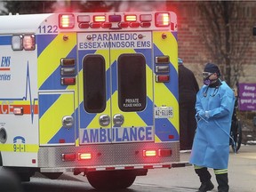 An ambulance prepares to leave The Village at St. Clair, a long-term care facility in Windsor. Photographed Jan. 5, 2021.