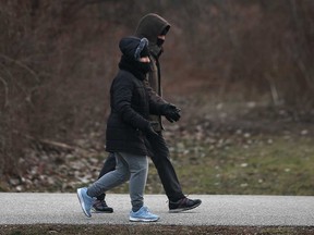 A pair of walkers enjoy Windsor's Ganatchio Trail on Jan. 11, 2021.