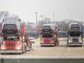 Newly built Chrysler Pacificas are unloaded at MotiPark after a blockade by Uniform members at the Windsor Assembly Plant was removed, Monday, January 11, 2020.