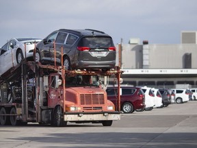 A transport truck exits the Windsor Assembly Plant after a blockade by Unifor was lifted, Tuesday, Jan. 19, 2021.