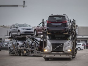 A transport truck hauling newly built Chrysler Pacificas leaves the Windsor Assembly Plant after a blockade by Uniform members was removed, Monday, January 11, 2020.