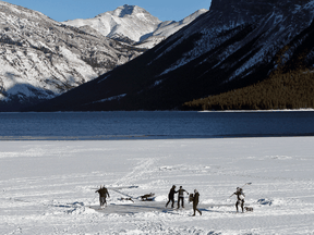 Ice skaters on Lake Minnewanka in Banff National Park on Jan. 13. Four people fell through the ice last weekend and one required a thin ice rescue response from Banff Visitor Safety.