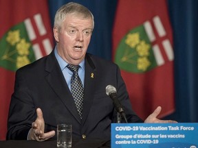 Retired General Rick Hillier, chair of the COVID-19 Vaccine Distribution Task force, responds to a question during a press conference at Queen's Park in Toronto on Friday, December 11, 2020.
