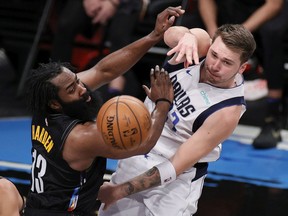 NEW YORK, NEW YORK - FEBRUARY 27: Luka Doncic #77 of the Dallas Mavericks passes the ball as James Harden #13 of the Brooklyn Nets defends during the second half at Barclays Center on February 27, 2021 in the Brooklyn borough of New York City. The Mavericks won 115-98. NOTE TO USER: User expressly acknowledges and agrees that, by downloading and or using this Photograph, user is consenting to the terms and conditions of the Getty Images License Agreement.