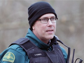 Point Pelee National Park warden Dan Forbes speaks with birdwatchers near the tip on Dec. 15, 2020. He had only just started his new job as warden of Canada's southernmost national park located at the southernmost point of Canada's mainland.
