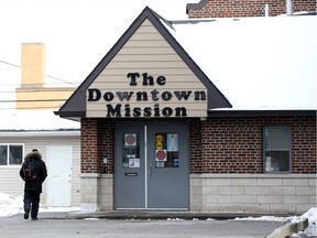 A COVID-19 outbreak has forced the creation of an emergency shelter at a former public library branch. The Downtown Mission's main office doors are shown here on Feb. 12, 2021.