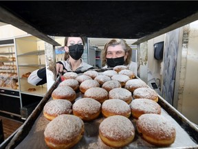 Preparing for a tasty Fat Tuesday. Julie Gill, left, and her mother, Valarie Blak-Gill, of Blak's Bakery in Windsor and shown Monday, Feb. 15, 2021, know a thing or two about paczkis having grown up in the family business which dates back to 1918 and spans four generations.