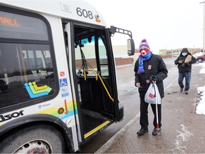 Passenger Emile Seguin prepares to board Transit Windsor's Crosstown 2 at the East Windsor bus terminal on Wednesday, Feb. 17, 2021. Ridership is way down due to the pandemic, but Seguin says he takes the bus multiple times per day, just to get to and from work.