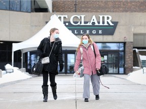 Record numbers, despite pandemic. St. Clair College culinary arts students Keely Pardo, left, and Jaclyn Stand are shown exiting the main campus on Friday, Feb. 19, 2021.