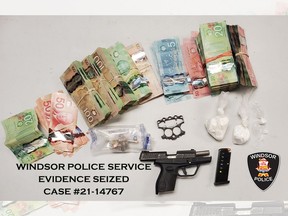 Windsor police seized cocaine, cash, a firearm, brass knuckles, ammunition, and a loaded magazine from a residence in the 900 block of Bridge Avenue on Monday, Feb. 22, 2021.