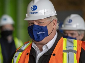 Ontario Premier Doug Ford arrives at a construction site in Toronto on Thursday, February 18, 2021.