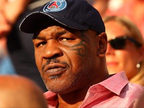 Former heavyweight boxer Mike Tyson attends the French Open at Roland Garros in Paris, June 2, 2018.