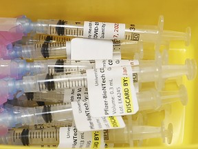 Prepare syringes of the Pfizer-BioNTech COVID-19 vaccine (Jack Boland/Toronto Sun)